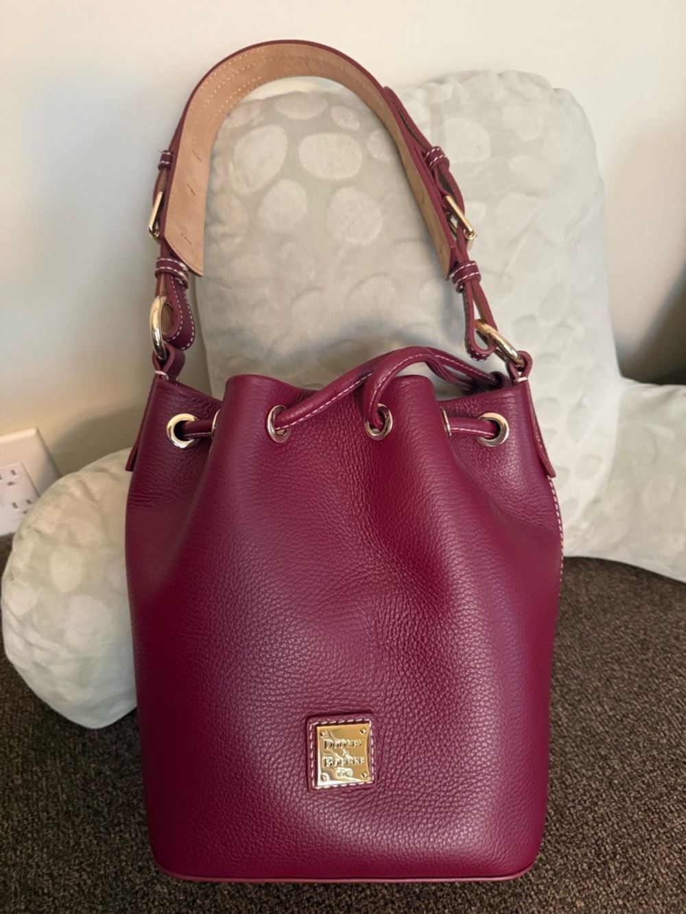 Dooney & Bourke Lucca Leather Small Drawstring
In Wine in EUC